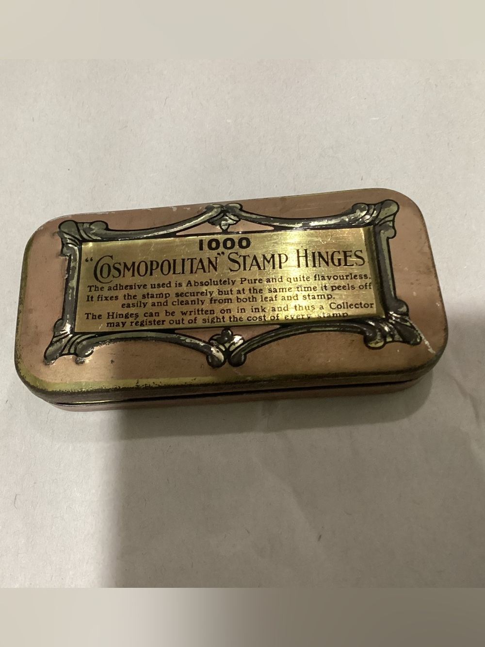 Vtg. “Cosmopolitan” Stamp Hinges 1000, tin box EMPTY. Pre-owned.